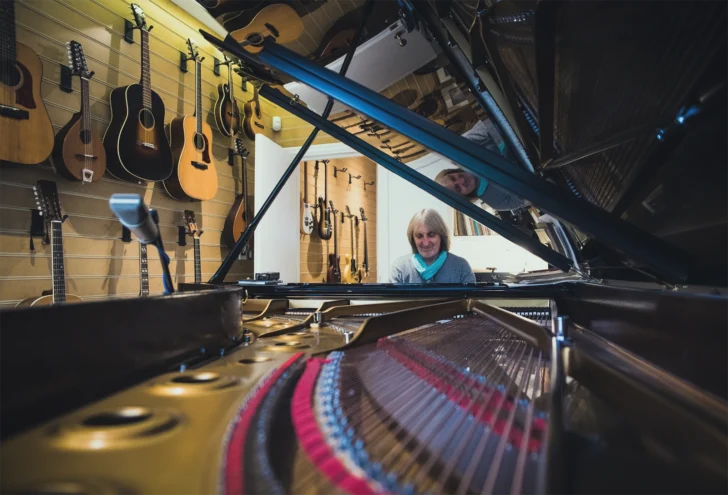 Anthony Phillips playing the Piano. Photo taken from the CD Booklet.